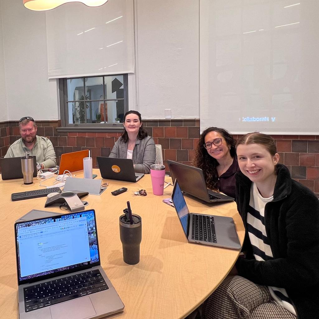 Team sitting around desk